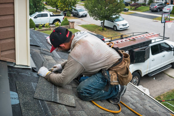 Professional Roof Replacement technician working in New York Mills, NY